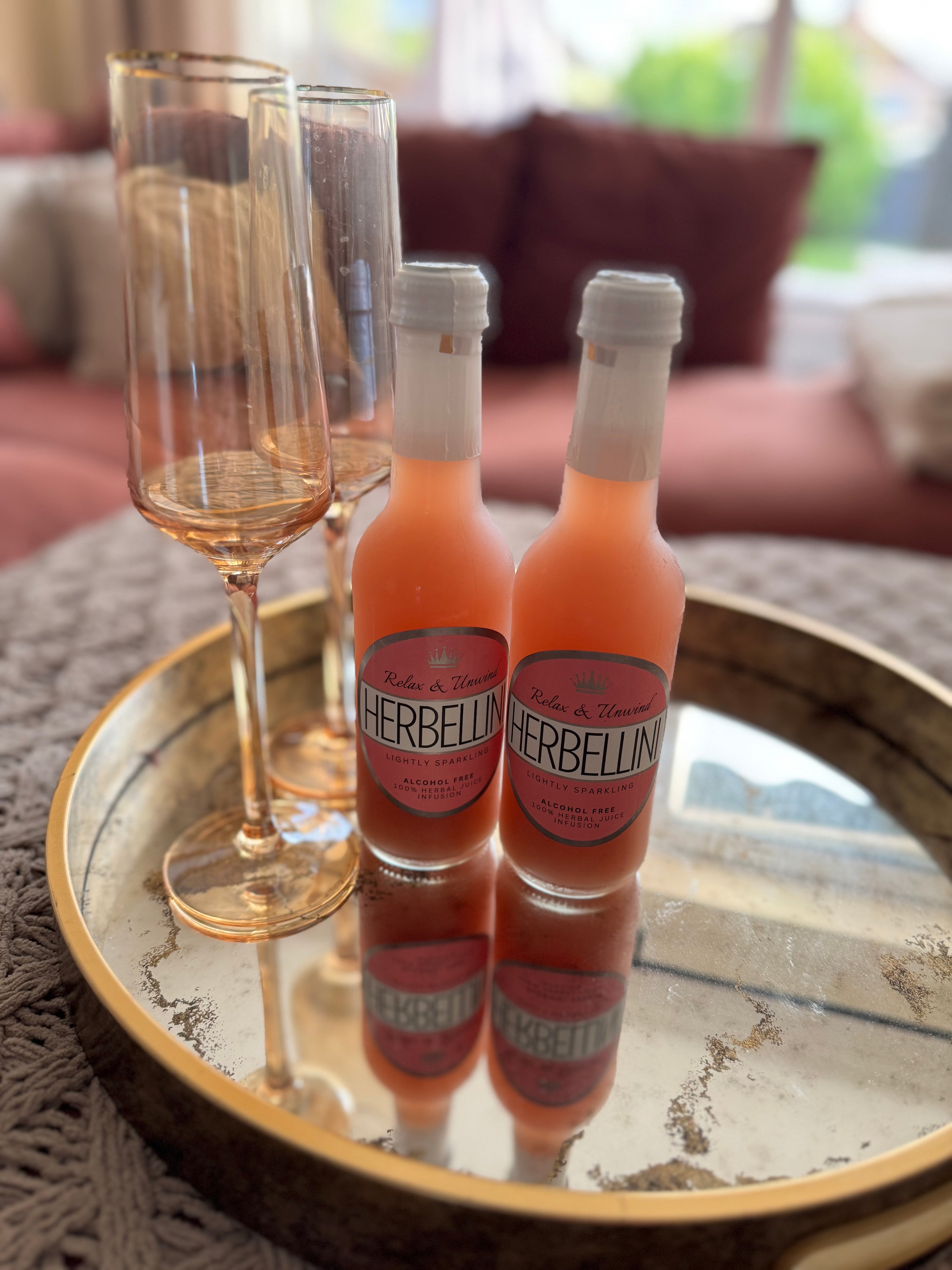 Herbellini Bottles On Bed